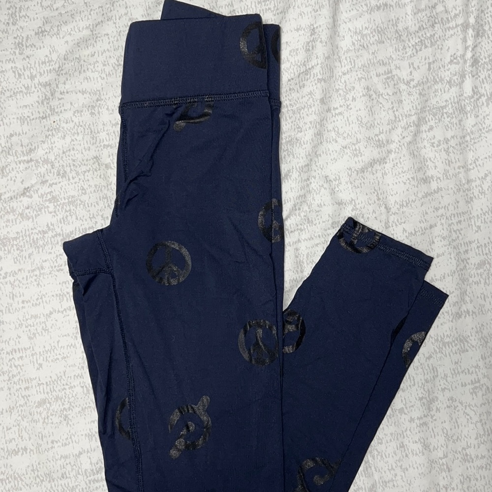 One Peloton x Terez Navy blue peace sign leggings